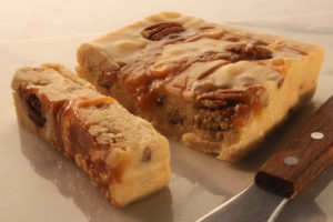 Allen Family Fudge - Vanilla butter pecan fudge with pecans and caramel mixed in a drizzled on top
